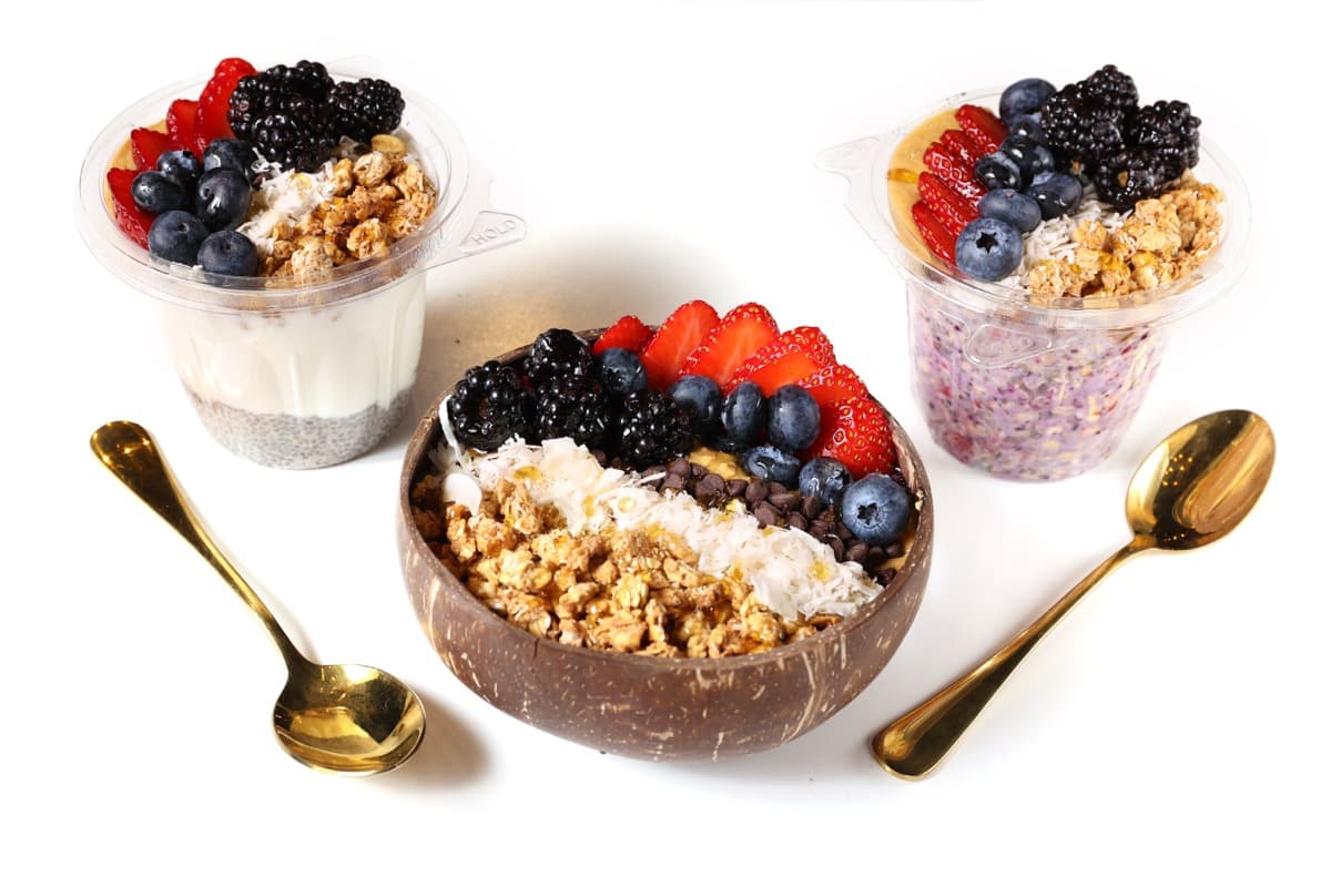 Acai bowl, overnight oats, and chia pudding with fresh berries