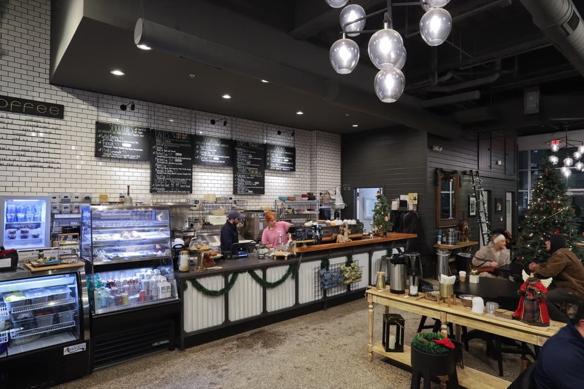 Coffee counter with chalkboard menu and subway tile