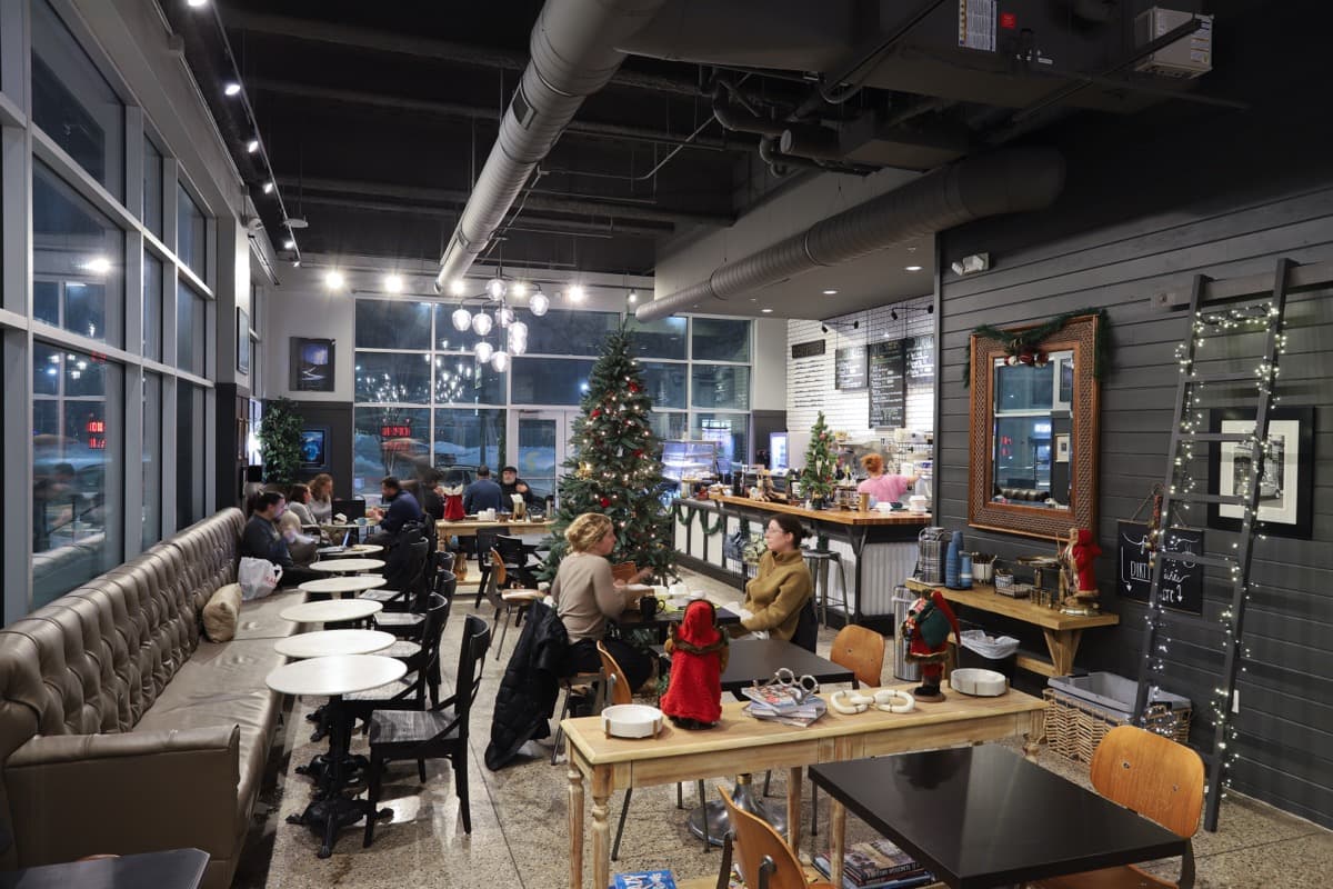 Evening cafe ambiance with leather booths and chandeliers