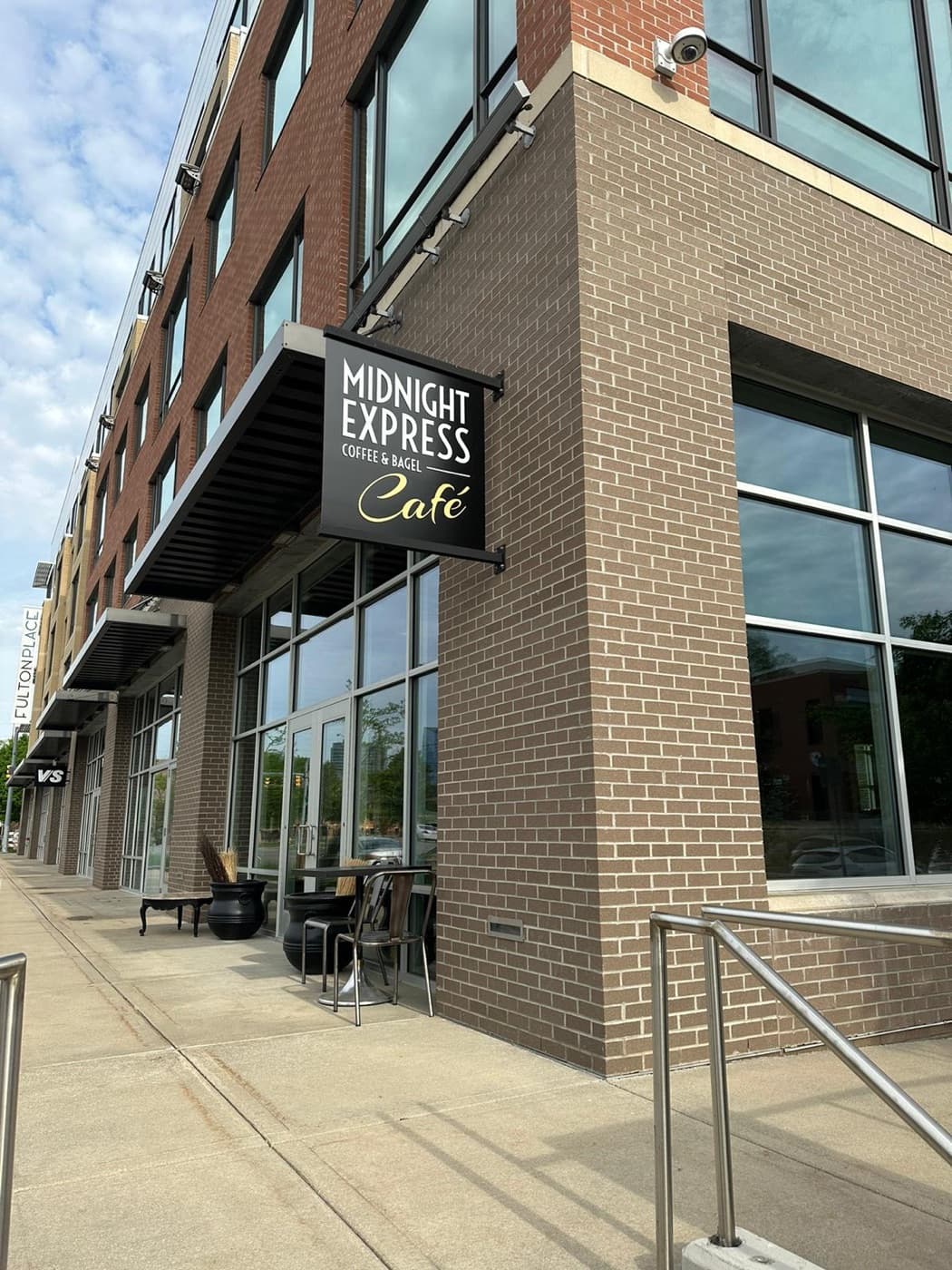 Midnight Express Cafe Fulton Street summer storefront with signage