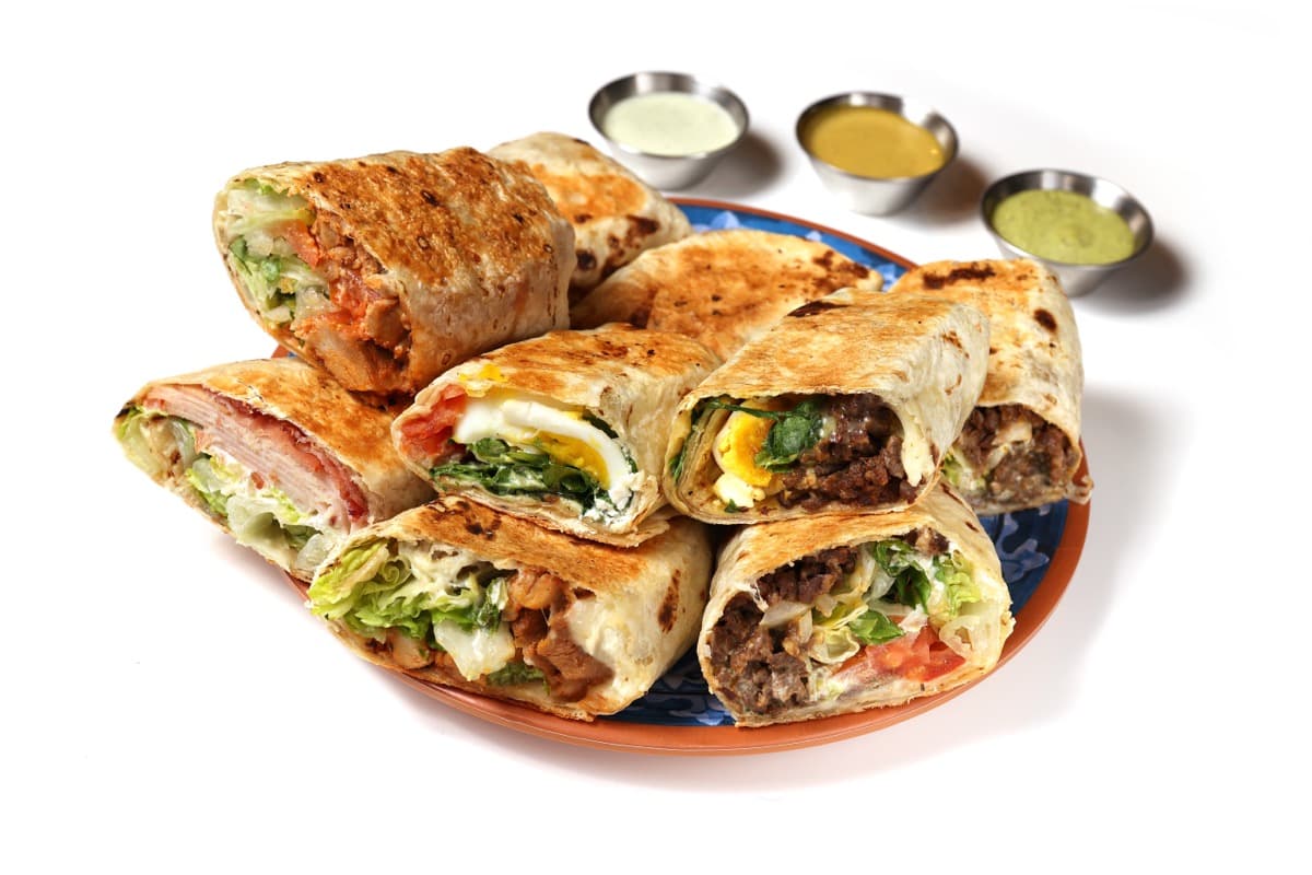 Flatbread wraps group plate with dipping sauces